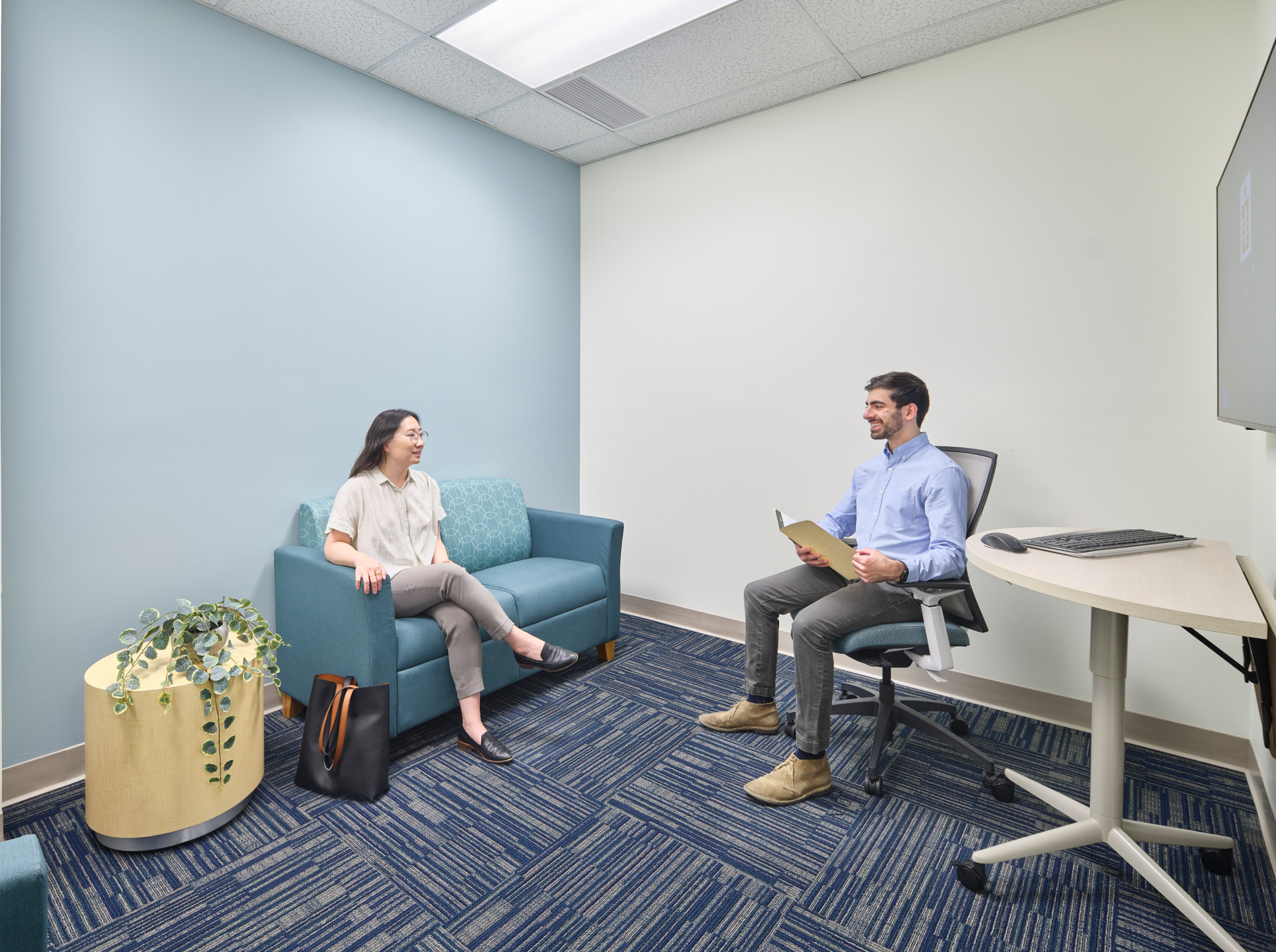 Nemours Rockland Reach meeting room with people talking to each other