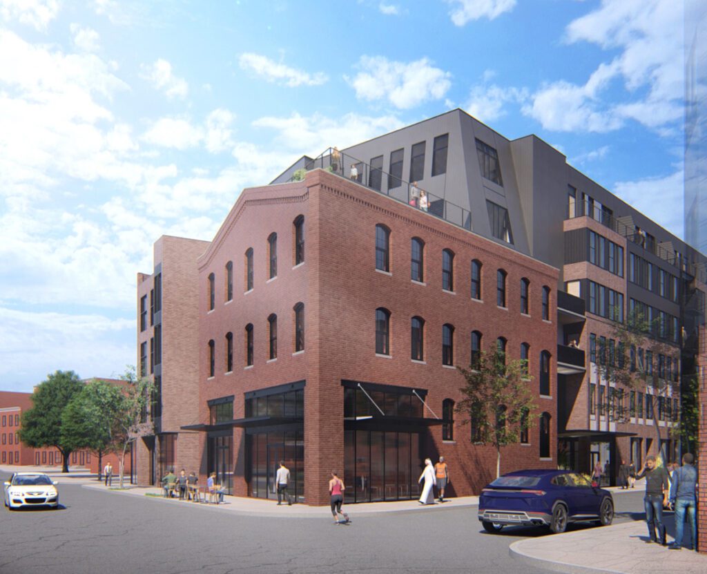 1700 N Howard Street exterior - corner view with cars passing by and people are moving around