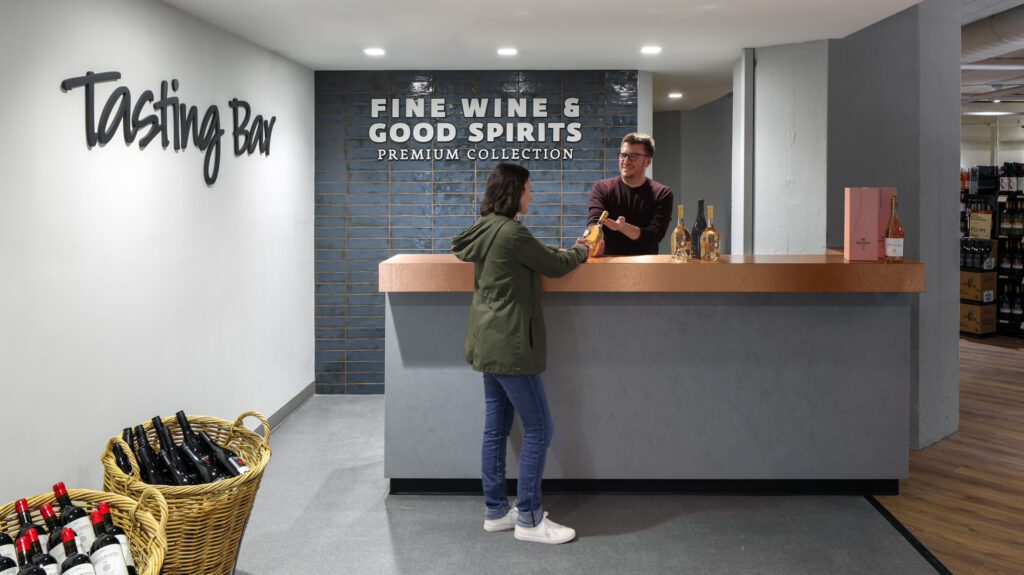 Fine and Wine Good Spirits tasting bar with two people talking to each other