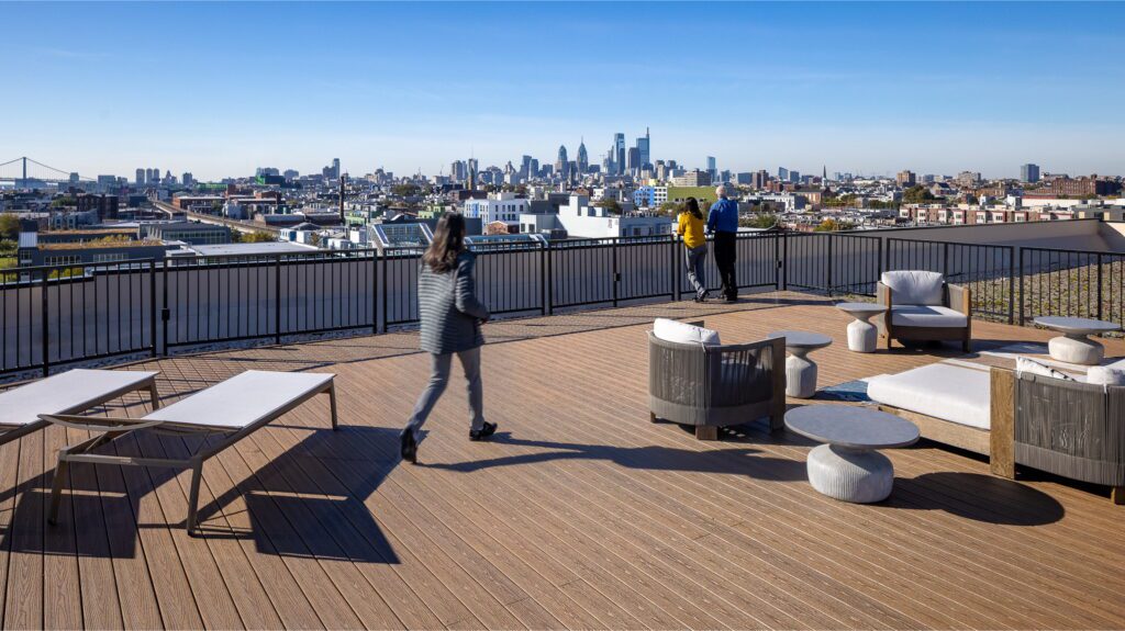 2110 E Norris street building roof top with the sitting area and people hanging around