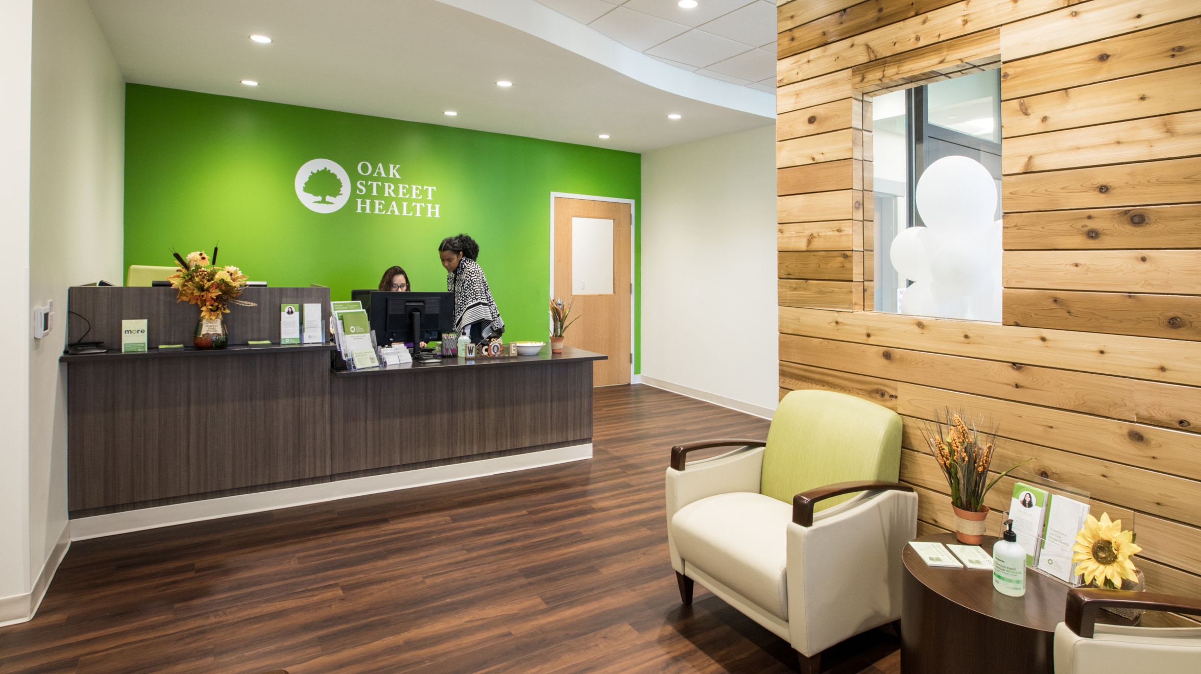 OSH reception desk where two woman are looking at a monitor