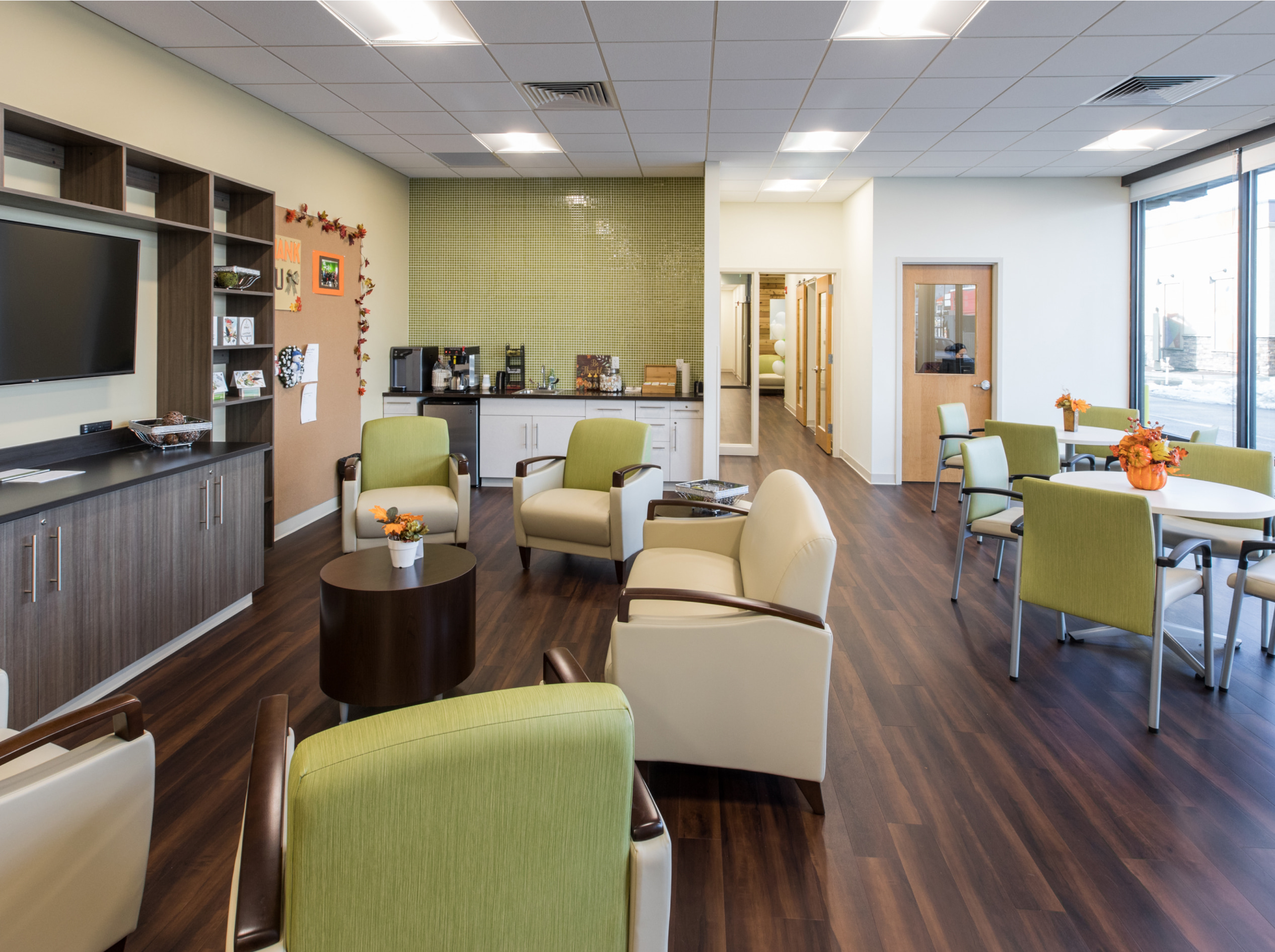 OSH common area with tv, chairs, and table