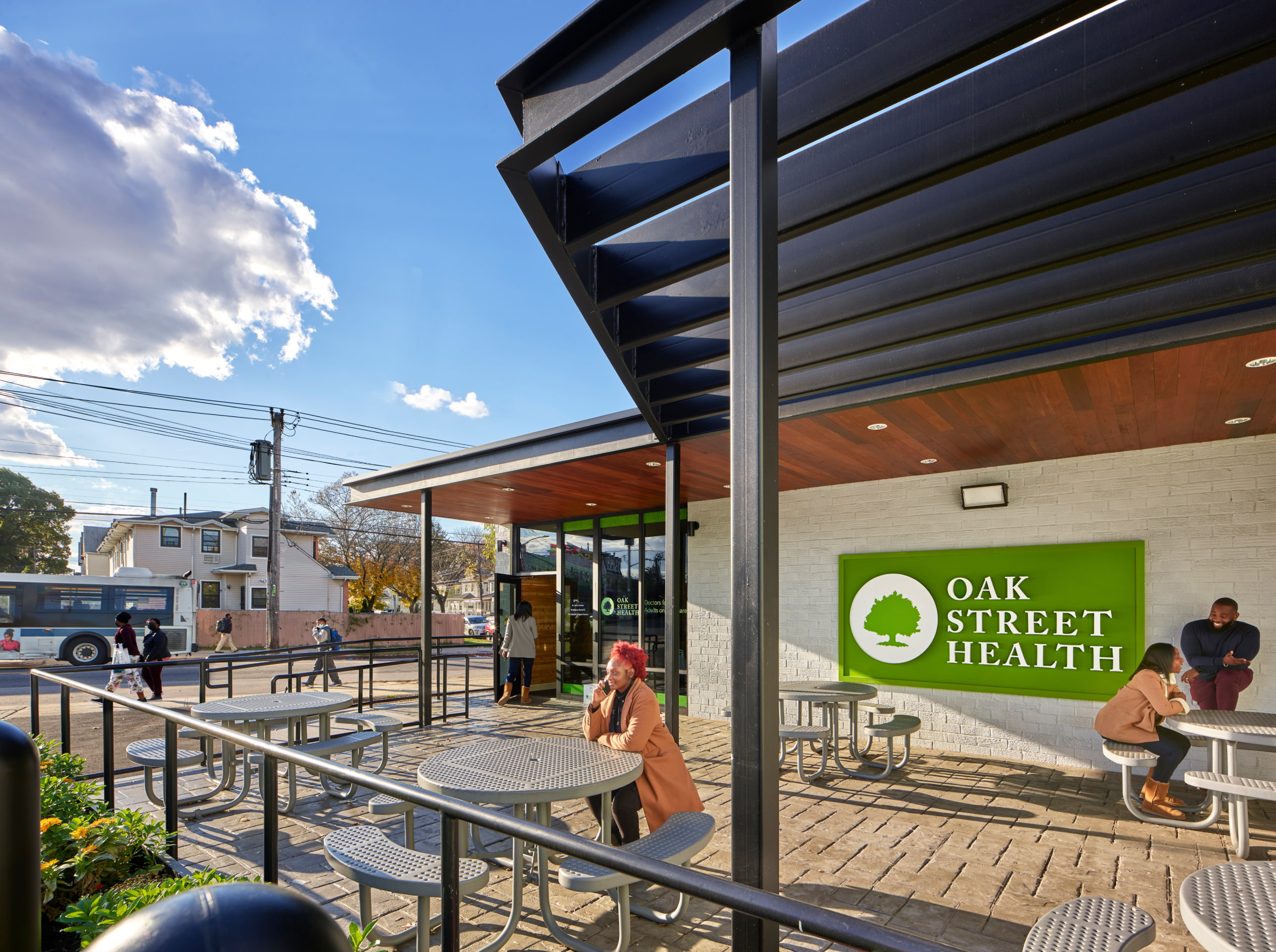 OSH outside view with sitting area where people are spending time together.